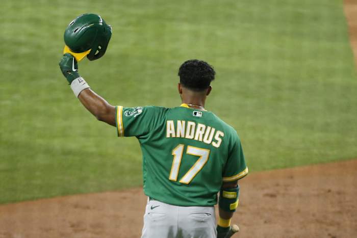 Jun 21, 2021; Arlington, Texas, USA; Oakland Athletics shortstop Elvis Andrus (17) tips his helmet before his at bat in the second inning against the Texas Rangers at Globe Life Field.